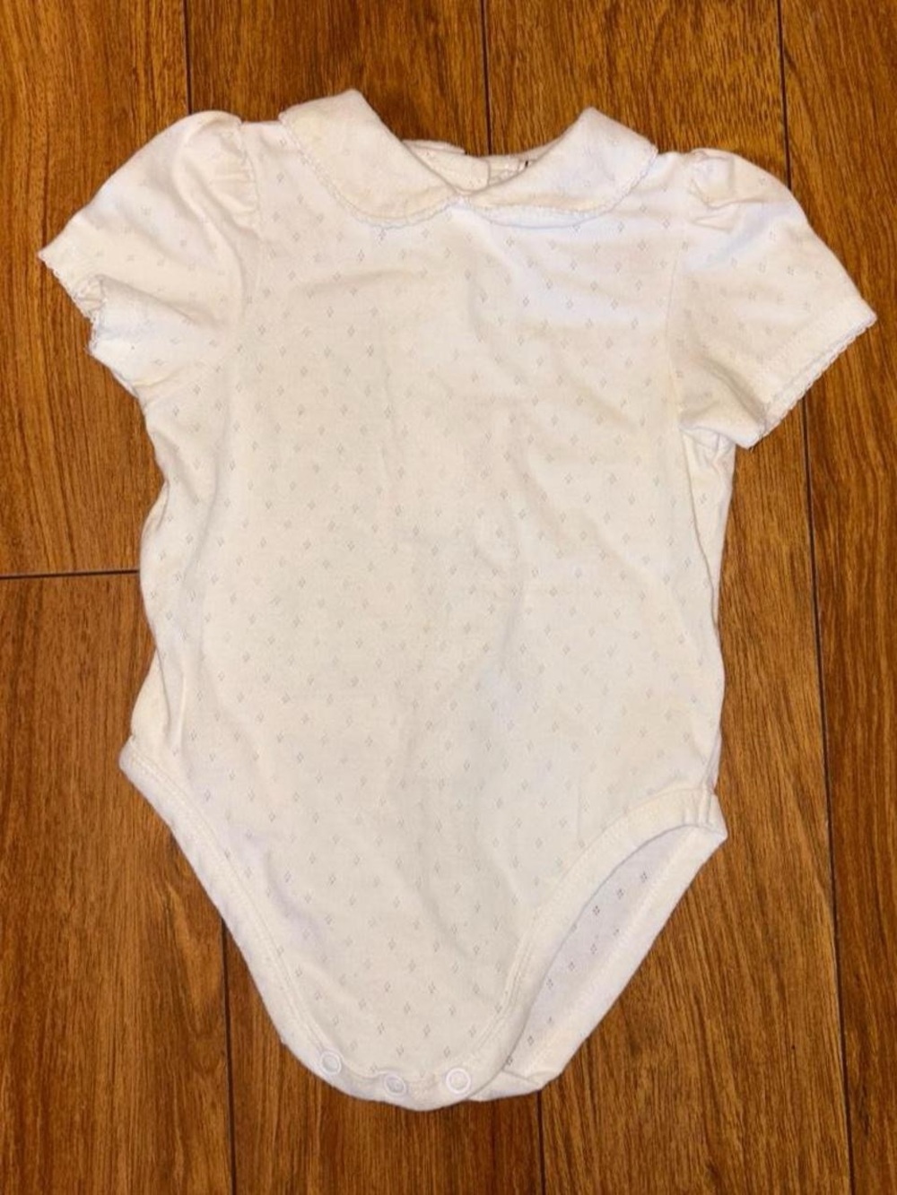 Vintage collared baby onesie with lace design